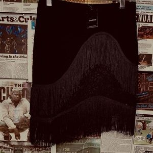 Asymmetrical bebe black skirt with lace detail